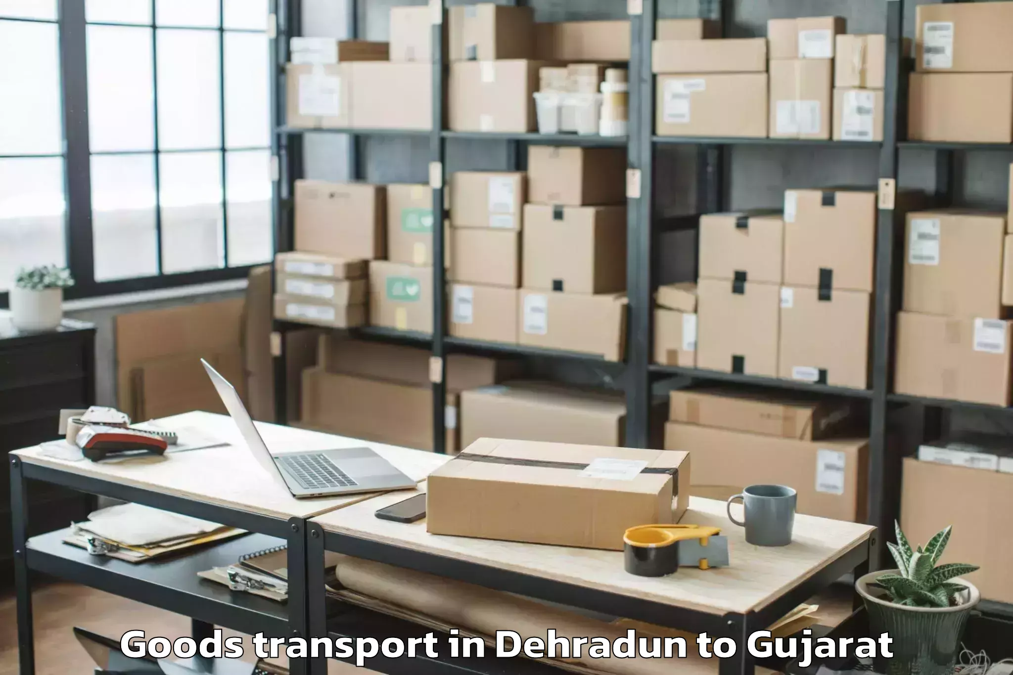 Professional Dehradun to Veer Narmad South Gujarat Univ Goods Transport